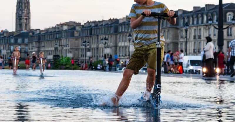 Kick scooter riding in wet weather